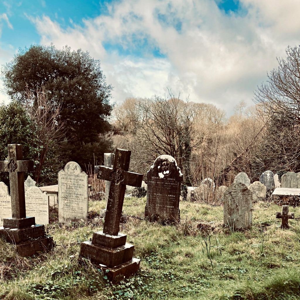 Early spring sunshine on gravestones in an ancient churchyard