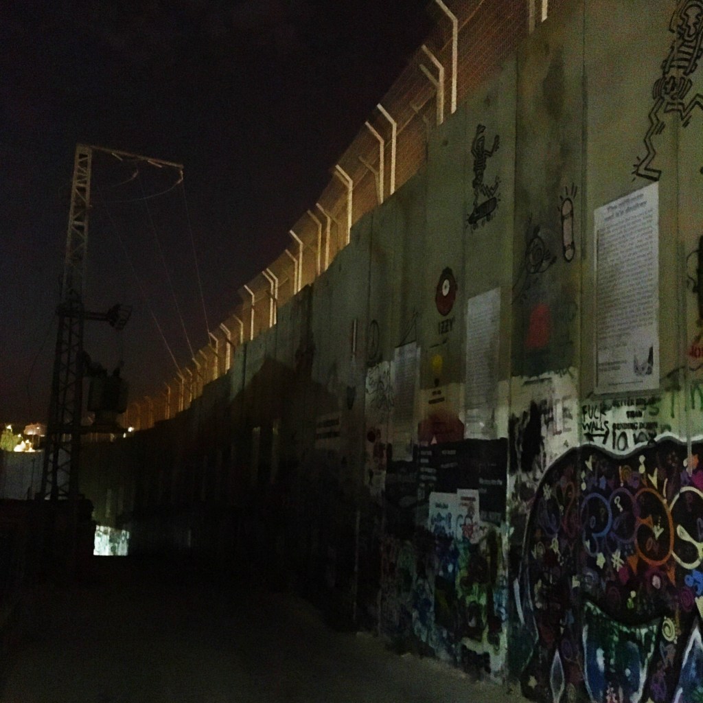 A view of the West Bank barrier at night, in Bethlehem.