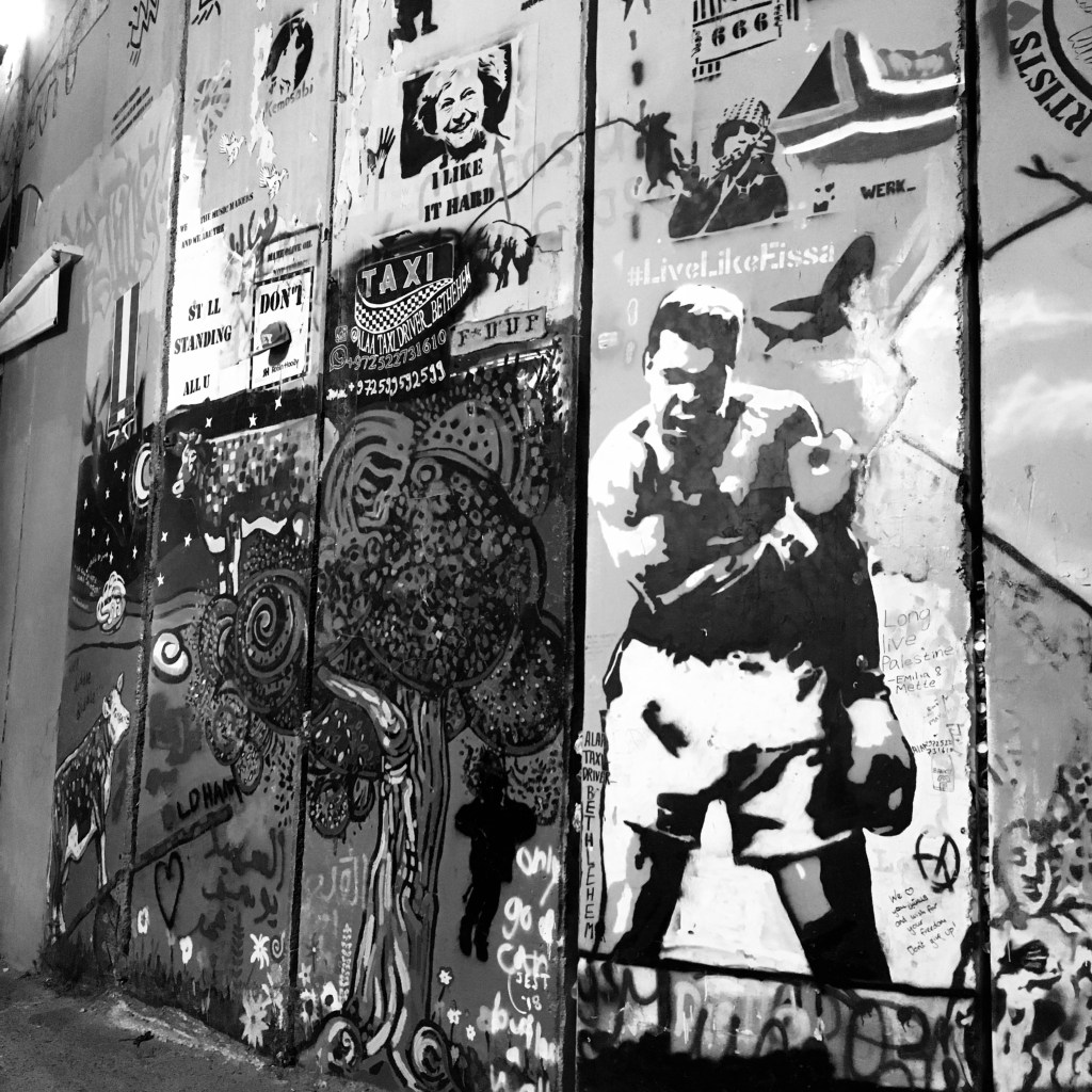 Graffiti on the Israeli defence wall in Bethlehem, showing the iconic image of Muhammad Ali yelling at Sonny Liston (not pictured) after knocking him out in May 1965.