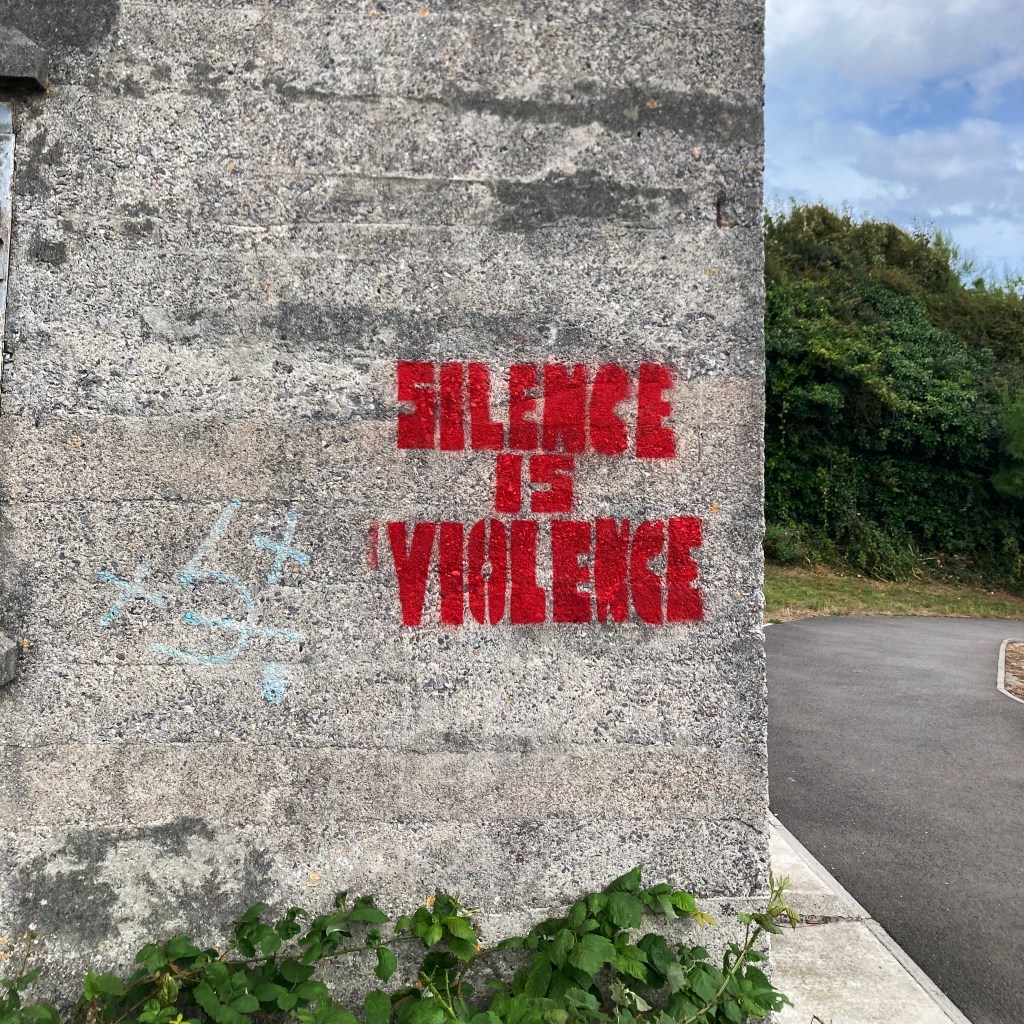 Graffiti on the wall of a fortified rampart in Plymouth, which reads 'Silence is violence'
