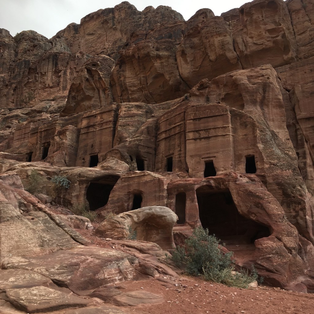 Caves carved into the sandstone cliffs of Petra